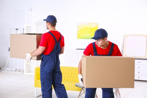 Removal company team preparing items for a UK house move