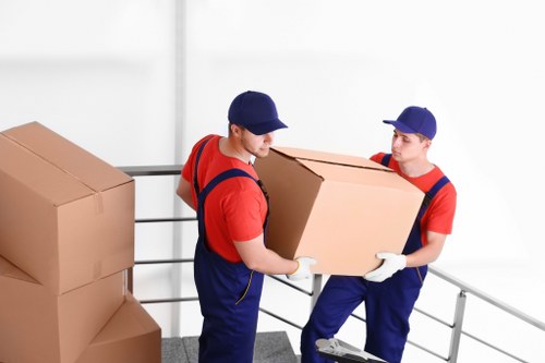 Packed office boxes and labelled items ready for relocation in Swiss Cottage