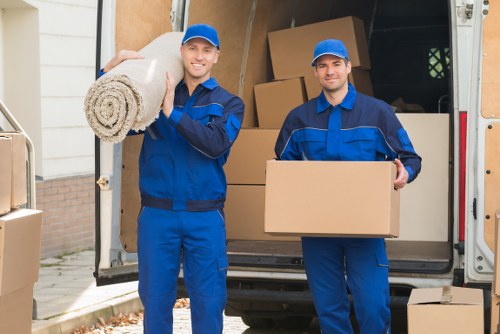 Local removals crew loading boxes for a move in Swiss Cottage